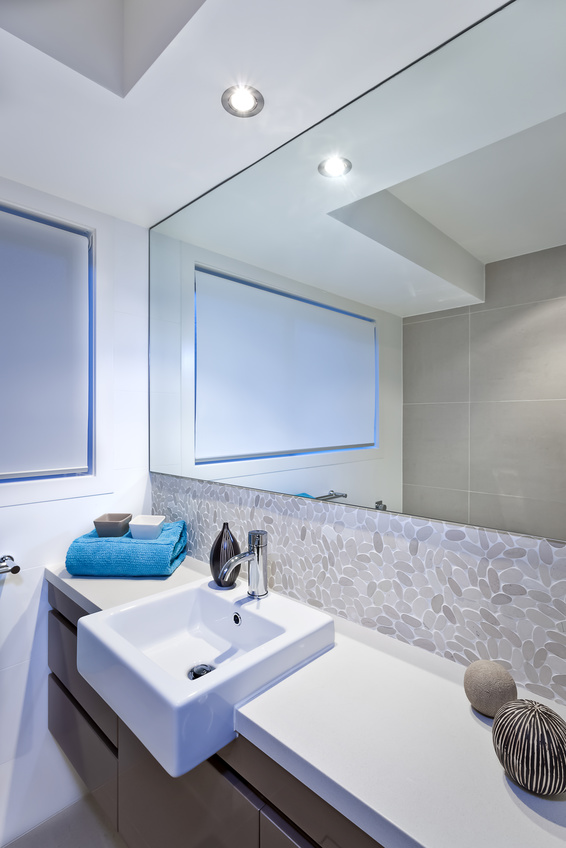 Luxury bathroom with wide mirrors and tap and sink
